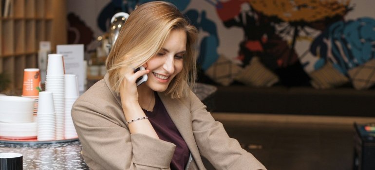 Moving Services 4 Woman contacting moving services Cincinnati Ohio residents rely on