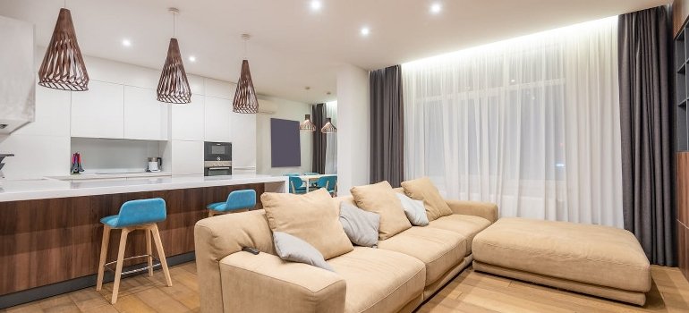 The Ultimate Moving Checklist for Relocating to Cincinnati 1 A modern apartment interior, photo of the living room and kitchen area.