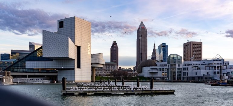 What's The Cost Of Living In Ohio? 1 A city skyline with a body of water-in Cleveland