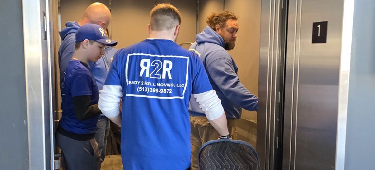 furniture movers in an elevator