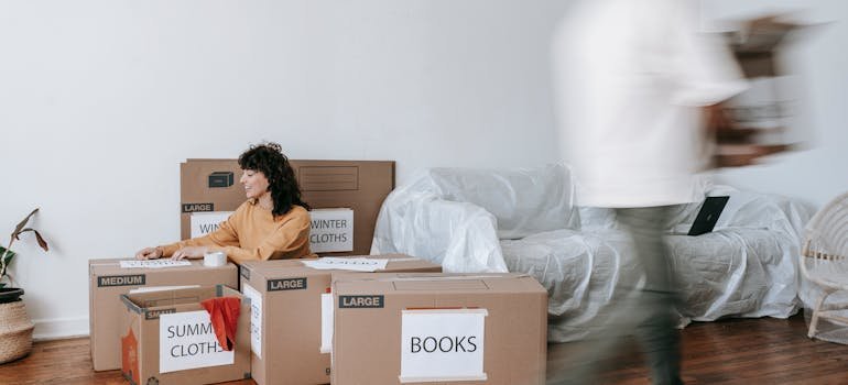 How to Pack Furniture When Moving to Cincinnati 3 a woman thinking about how to pack furniture when moving