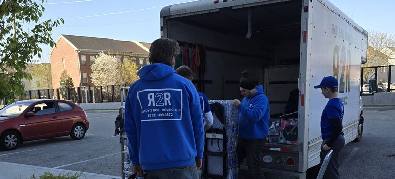 movers next to a moving truck