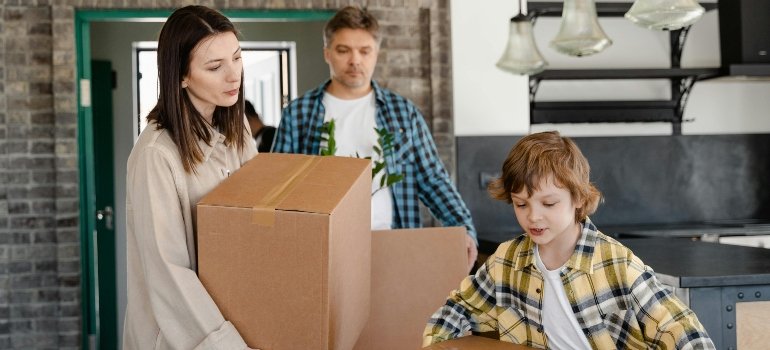 How To Unpack After Moving To Milford Ohio 1 Family unpacking after a move