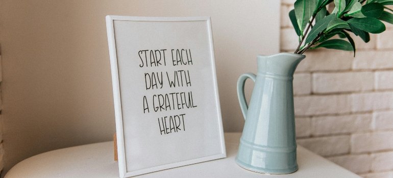How To Make Moving Less Stressful 3 Gray Ceramic Vase and a framed positive vibes picture