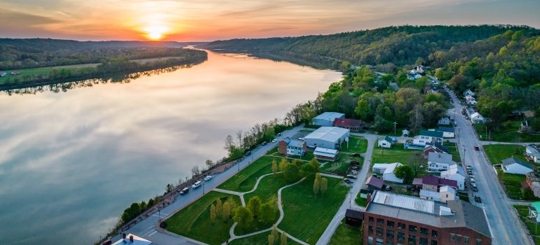 Why Are Companies Moving To Ohio? 2 A body of water with buildings and trees