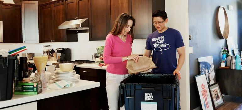 How To Pack China For Moving? 3 a woman showing how to pack fine china for moving