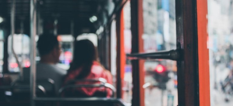 Relocating Your Family to Lebanon Ohio: Schools, Parks & Services 2 A couple sits closely together inside a bus, good public transport is one of the reason for relocating your family to Lebanon Ohio