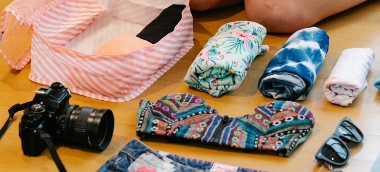 How to Pack Clothes for Moving Like a Pro 3 Essentials bag showing how to pack clothes for moving with outfits, pajamas, and toiletries ready for the first days.