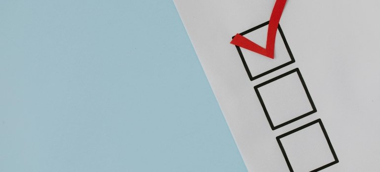 How to Prepare for a Rural-Style Move to Indian Hill, Ohio 3 Close-up of a paper checklist with empty boxes and a bold red checkmark at the top to help you prepare for a rural-style move