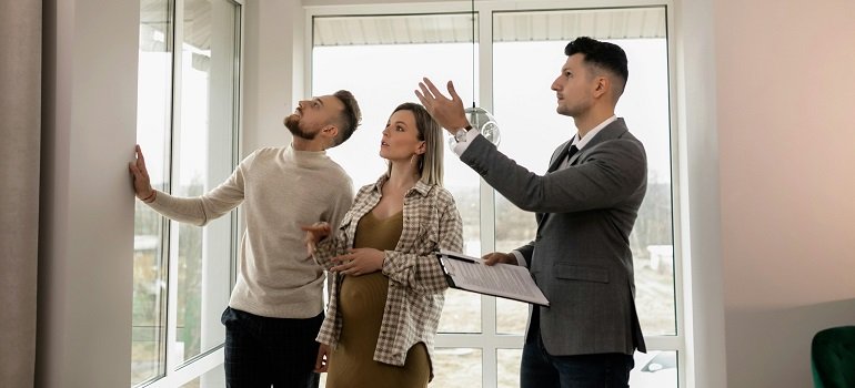 Challenges of moving to Milford OH and how to handle them 3 Couple touring new Milford home with real estate agent