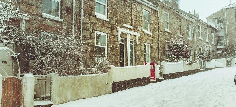 Hidden hazards of steep hills and icy streets during December moves 1 Rowhouses along steep hills and icy streets during December moves