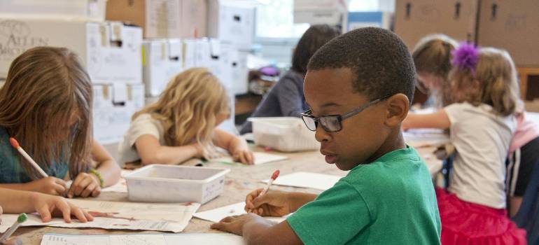 The ultimate guide to a family relocation to Middletown OH 4 Kids in a classroom learning during family relocation to Middletown OH.