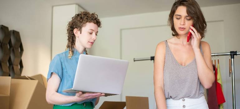 Essential corporate relocation guide for Fairfield OH companies 1 Colleagues coordinating office move with laptop