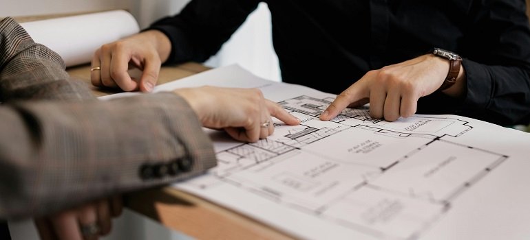 The ultimate guide to moving to Indian Hill OH in 2026 4 Couple reviewing Indian Hill home floor plans