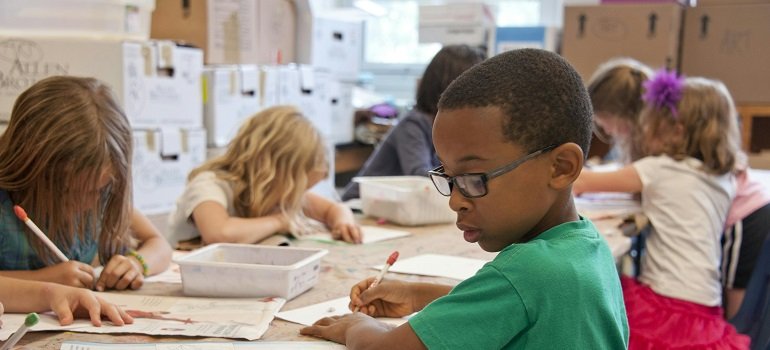 The ultimate guide to moving to Indian Hill OH in 2026 6 Elementary students working on classroom art projects