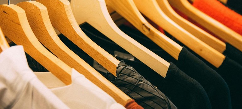 4 easy items to get rid of before moving 2 clothes on hangers