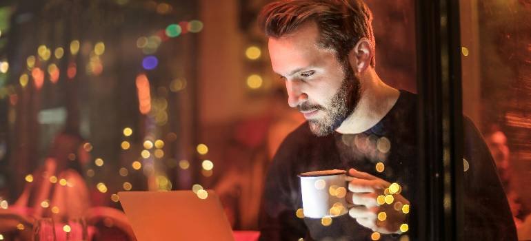 Top places in the Greater Cincinnati metro area for young professionals 2 Man working late on laptop with coffee