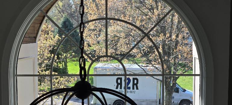 The ultimate guide for a spring move to Harrison OH 1 Ready2Roll truck parked beside blooming neighborhood tree