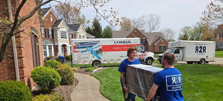 The ultimate guide for a spring move to Harrison OH 7 Moving crew loading truck in quiet suburban street