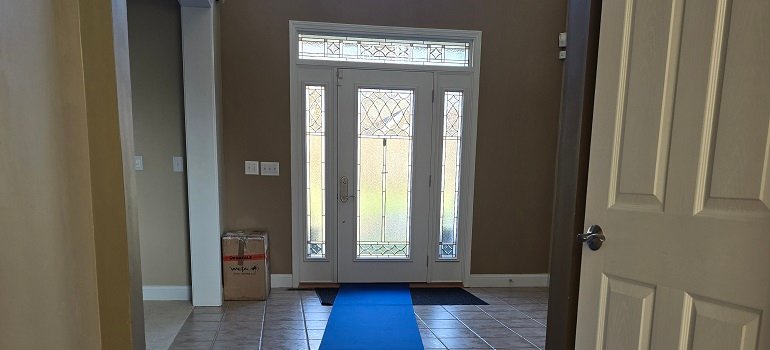 Spring cleaning in Loveland Ohio: Room-by-room checklist 2 Protected entryway with floor runner during moving day.