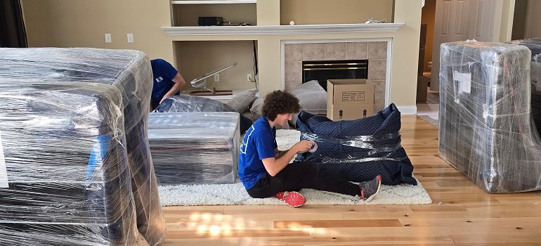 How to efficiently pack for your move 2 Team preparing furniture to pack for your move