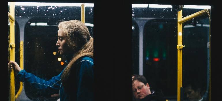 Benefits of living in Cincinnati suburbs 4 Commuter riding evening bus from Cincinnati suburbs