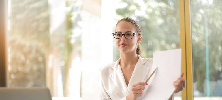 Benefits of living in Cincinnati suburbs 7 Young professional reviewing paperwork near bright office window